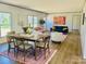 Bright dining room features a wood table and area rug at 3144 Rickwood Dr, Newton, NC 28658