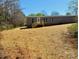 Inviting single-story home featuring a lovely front porch and a well-maintained yard with beautiful landscaping at 3144 Rickwood Dr, Newton, NC 28658