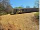 Ranch style home featuring a covered front porch and a large yard at 3144 Rickwood Dr, Newton, NC 28658