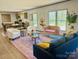 Spacious living room has an area rug, chairs, and a couch at 3144 Rickwood Dr, Newton, NC 28658