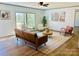 Bright living area featuring a blend of modern and comfortable seating with natural light at 3144 Rickwood Dr, Newton, NC 28658