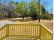 View from the porch of the home's front yard featuring a circle driveway and mature trees at 3144 Rickwood Dr, Newton, NC 28658