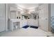 Bright bathroom featuring dual sinks, white cabinetry, and large mirrors at 3717 Bodenham Ct, Charlotte, NC 28215