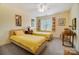 Cozy bedroom with twin beds, natural light and a ceiling fan at 3717 Bodenham Ct, Charlotte, NC 28215