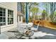 Enjoy outdoor living with this comfortable deck that includes a seating area shaded by an umbrella at 3717 Bodenham Ct, Charlotte, NC 28215