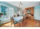 Bright dining area with large windows, hardwood floors, and seamless access to other rooms at 3717 Bodenham Ct, Charlotte, NC 28215