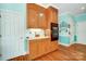 Functional kitchen area featuring wood cabinets, double oven, and plenty of storage space at 3717 Bodenham Ct, Charlotte, NC 28215