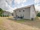 Large backyard with a patio, fire pit, and grassy area at 3810 New Salem Rd, Monroe, NC 28110