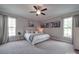 Bright bedroom features large windows, neutral walls, carpeted floors, and stylish furnishings at 3810 New Salem Rd, Monroe, NC 28110