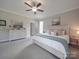 Cozy bedroom boasts a ceiling fan, neutral walls, carpeted floors, and a dresser with decorative mirrors at 3810 New Salem Rd, Monroe, NC 28110