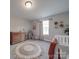 Bright Bedroom with a round woven rug, changing table, and decor at 3810 New Salem Rd, Monroe, NC 28110