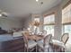 Dining area with table set for four with seamless flow into the living room is great for entertaining at 3810 New Salem Rd, Monroe, NC 28110