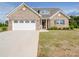 Beautiful brick home with a large driveway and well-manicured landscaping at 3810 New Salem Rd, Monroe, NC 28110