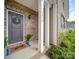 Inviting front entrance with brick accents, elegant door, and a welcoming wreath at 3810 New Salem Rd, Monroe, NC 28110