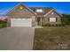 Charming single-story brick home with a two-car garage and inviting front yard at 3810 New Salem Rd, Monroe, NC 28110