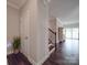 Entrance hallway with wooden stairs to the left and sunroom at the back is modern at 3810 New Salem Rd, Monroe, NC 28110