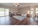 Spacious living room with a comfortable sectional sofa and sliding glass doors to the backyard at 3810 New Salem Rd, Monroe, NC 28110