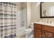 Well-lit bathroom featuring a shower and tub combination, vanity with ample storage at 39617 Rosebay Ct, Fort Mill, SC 29707