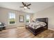 Bright bedroom with large windows and comfortable furnishings at 39617 Rosebay Ct, Fort Mill, SC 29707