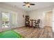Versatile bonus room with golf game and outdoor access through elegant French doors at 39617 Rosebay Ct, Fort Mill, SC 29707
