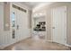 Bright and inviting foyer features tile flooring and an open view to a well-lit home office space at 39617 Rosebay Ct, Fort Mill, SC 29707