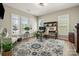 Cozy home office with plantation shutters, neutral paint, stylish rug, and plenty of natural light at 39617 Rosebay Ct, Fort Mill, SC 29707