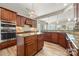Well-equipped kitchen with custom cabinets, stainless steel appliances, granite countertops, and center island at 39617 Rosebay Ct, Fort Mill, SC 29707