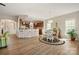 Open-concept kitchen and dining area with counter seating and hardwood floors throughout at 39617 Rosebay Ct, Fort Mill, SC 29707