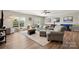 Cozy living area with plush seating, flooded with natural light, and open to game area at 39617 Rosebay Ct, Fort Mill, SC 29707