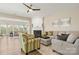 Spacious living room featuring a fireplace, neutral tones, comfortable seating, and hardwood flooring at 39617 Rosebay Ct, Fort Mill, SC 29707