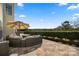 Spacious outdoor patio with plush seating and an umbrella, overlooking serene views and providing a relaxing retreat at 39617 Rosebay Ct, Fort Mill, SC 29707
