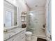 Bright bathroom features a tiled shower with a glass door and granite countertop vanity with a white under-mount sink at 406 Sugar Maple Ln, Weddington, NC 28104
