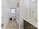Traditional bathroom with tile floor, walk-in shower, tub, and a vanity with a marble top that provides a spa-like experience at 406 Sugar Maple Ln, Weddington, NC 28104