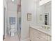 Clean bathroom boasts modern fixtures, a glass-enclosed shower, toilet, and a vanity with marble countertops and white cabinets at 406 Sugar Maple Ln, Weddington, NC 28104