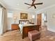 This spacious primary bedroom includes a king bed, wooden floors and access to a luxury bathroom at 406 Sugar Maple Ln, Weddington, NC 28104