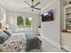 A comfortable bedroom with a floral king bed, neutral walls, and view to the private pool at 406 Sugar Maple Ln, Weddington, NC 28104