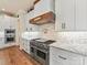 Gourmet kitchen featuring granite countertops, custom cabinets, and stainless steel appliances at 406 Sugar Maple Ln, Weddington, NC 28104