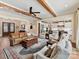 Open-concept living room showcasing hardwood floors and seamless flow to the kitchen at 406 Sugar Maple Ln, Weddington, NC 28104