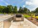 Outdoor kitchen with a built-in grill and stainless steel cabinets at 406 Sugar Maple Ln, Weddington, NC 28104