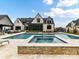 Beautiful pool with an attached spa and a spacious patio perfect for outdoor entertaining at 406 Sugar Maple Ln, Weddington, NC 28104