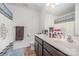 Bathroom with double sink vanity, with large mirror and bath with curtain at 428 Wheat Field Dr, Mount Holly, NC 28120