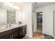 Bathroom with double sink vanity and walk-in closet at 428 Wheat Field Dr, Mount Holly, NC 28120