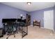 Bedroom with natural light, a work desk with multiple monitors, and a comfortable chair at 428 Wheat Field Dr, Mount Holly, NC 28120