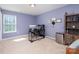 Bedroom with natural light, a work desk, and a modern dresser with shelving at 428 Wheat Field Dr, Mount Holly, NC 28120