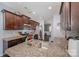 Kitchen featuring granite countertops, stainless appliances, and dark wood cabinetry at 428 Wheat Field Dr, Mount Holly, NC 28120