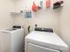 Well-lit laundry room equipped with modern washing machine and dryer units at 428 Wheat Field Dr, Mount Holly, NC 28120