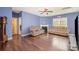 Cozy living room with plush reclining sofas, fireplace, and hardwood floors, perfect for relaxing and entertaining at 428 Wheat Field Dr, Mount Holly, NC 28120