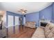 Inviting living room with hardwood floors, fireplace, and comfortable seating, ideal for Gathering and guests at 428 Wheat Field Dr, Mount Holly, NC 28120