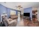 Spacious living room with hardwood floors, fireplace, and an open layout connecting to the kitchen and dining area at 428 Wheat Field Dr, Mount Holly, NC 28120