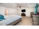 Expansive main bedroom with ceiling fan, television, and ensuite access at 428 Wheat Field Dr, Mount Holly, NC 28120